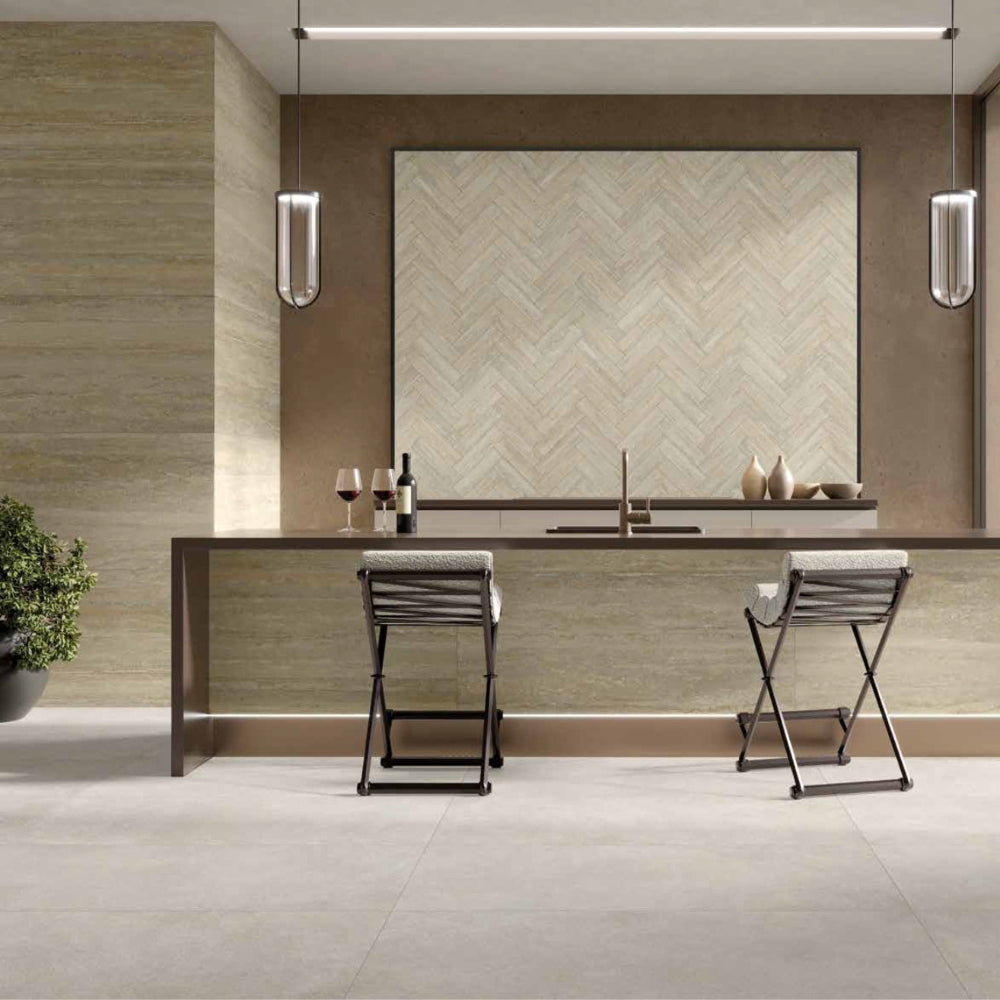 Modern kitchen with MGM ceramiche Nocciola wall on the side, bar stools, and a window view.