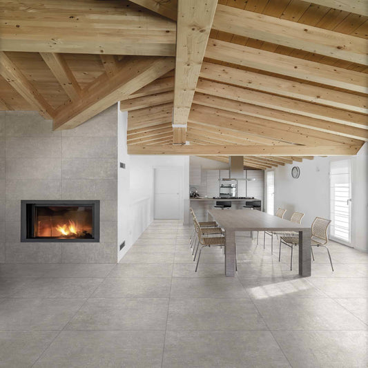 Modern interior with wooden ceiling, fireplace, and dining area.