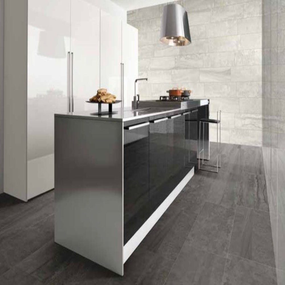 Modern kitchen with a sleek island and tiled walls.